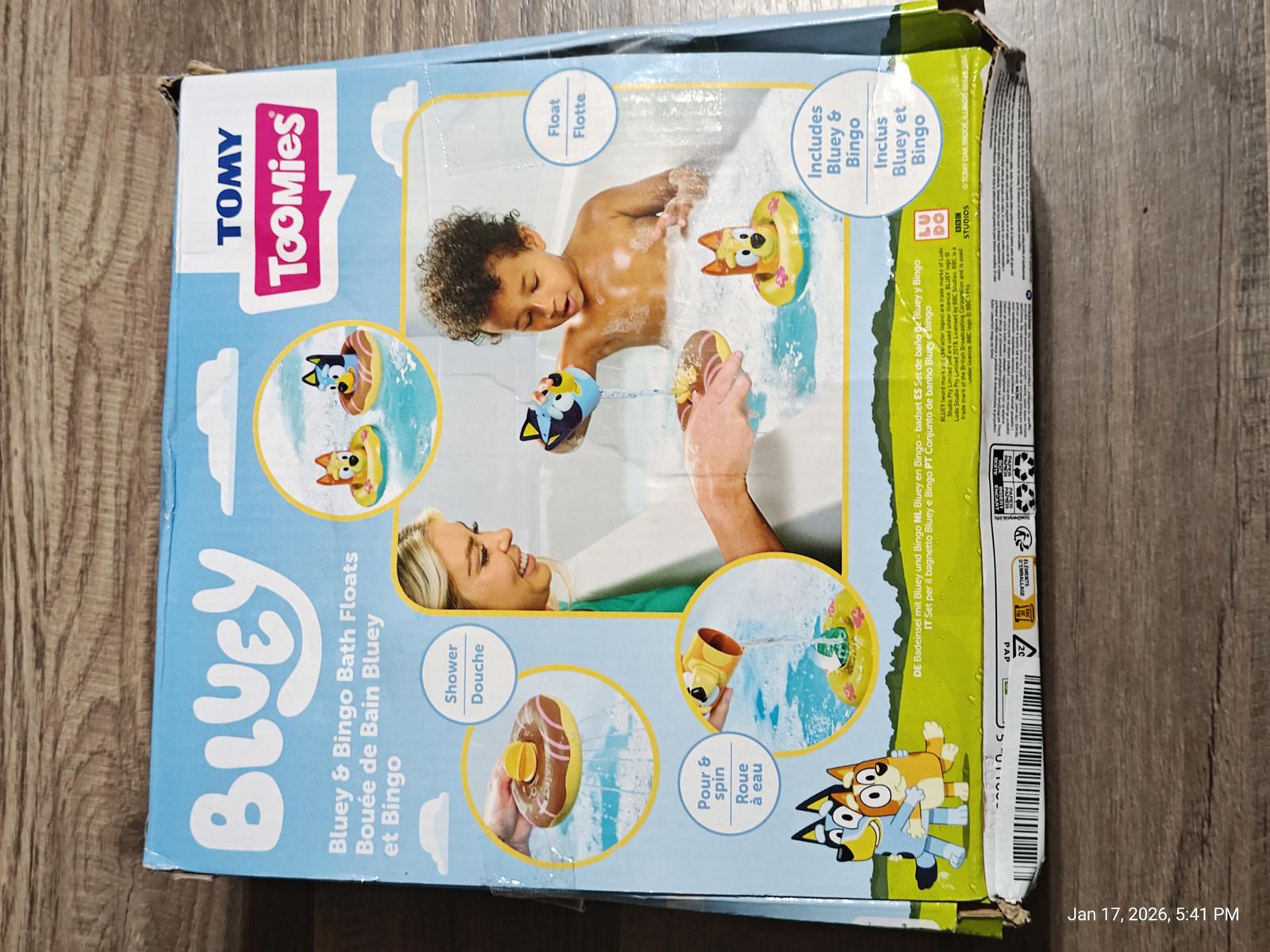 Bluey water play set by Tomy featuring colorful floating toys and a child enjoying bath time.
