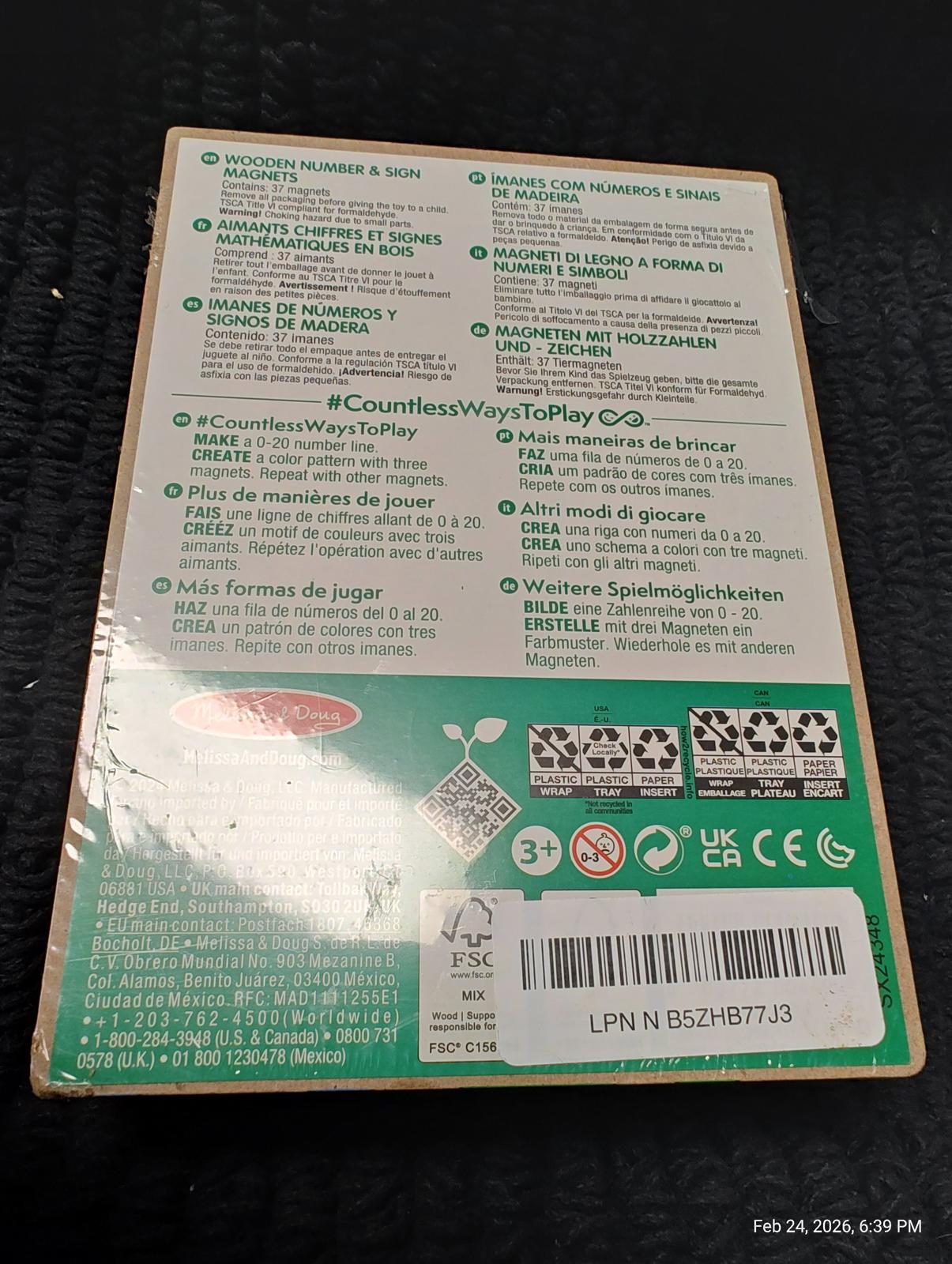 Product packaging for a board game featuring instructions in multiple languages.