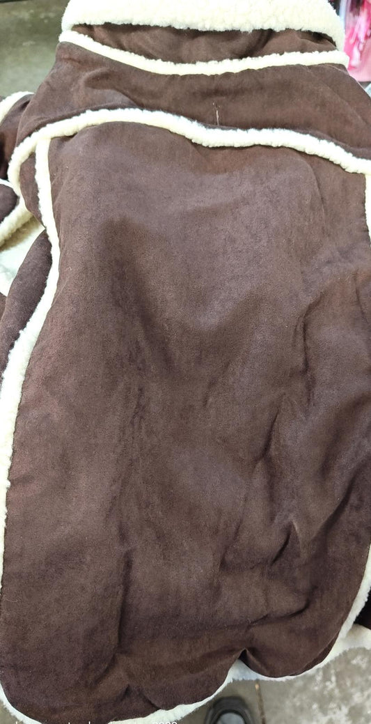 Brown fleece blanket with soft texture and cream trim.