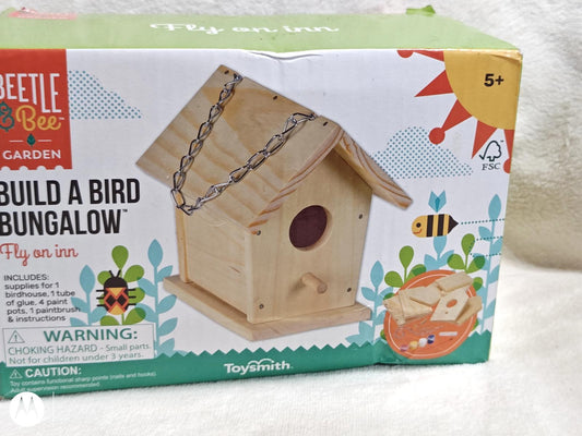 Build a Bird Bungalow kit by Beetle & Bee, featuring a wooden birdhouse design with accessories.