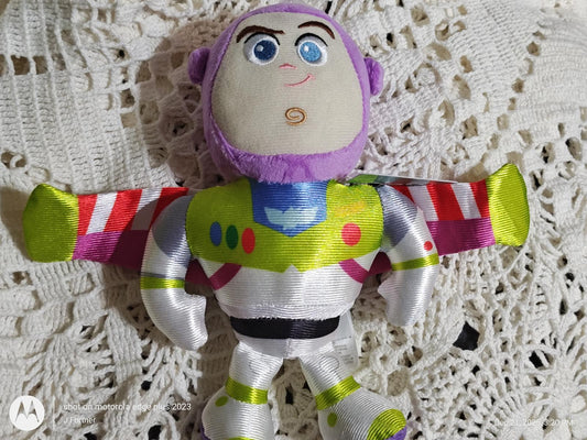 Buzz Lightyear plush toy with vibrant colors and detailed features.