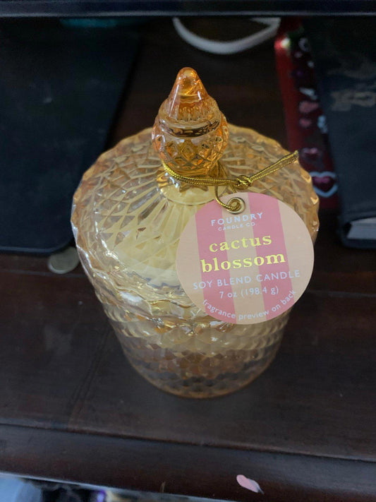 Cactus Blossom candle in a decorative glass jar with a textured design.