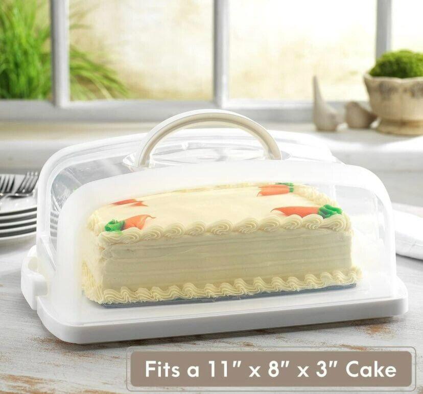 Cake carrier for 11" x 8" x 3" cake with clear lid and handle, featuring decorative icing.