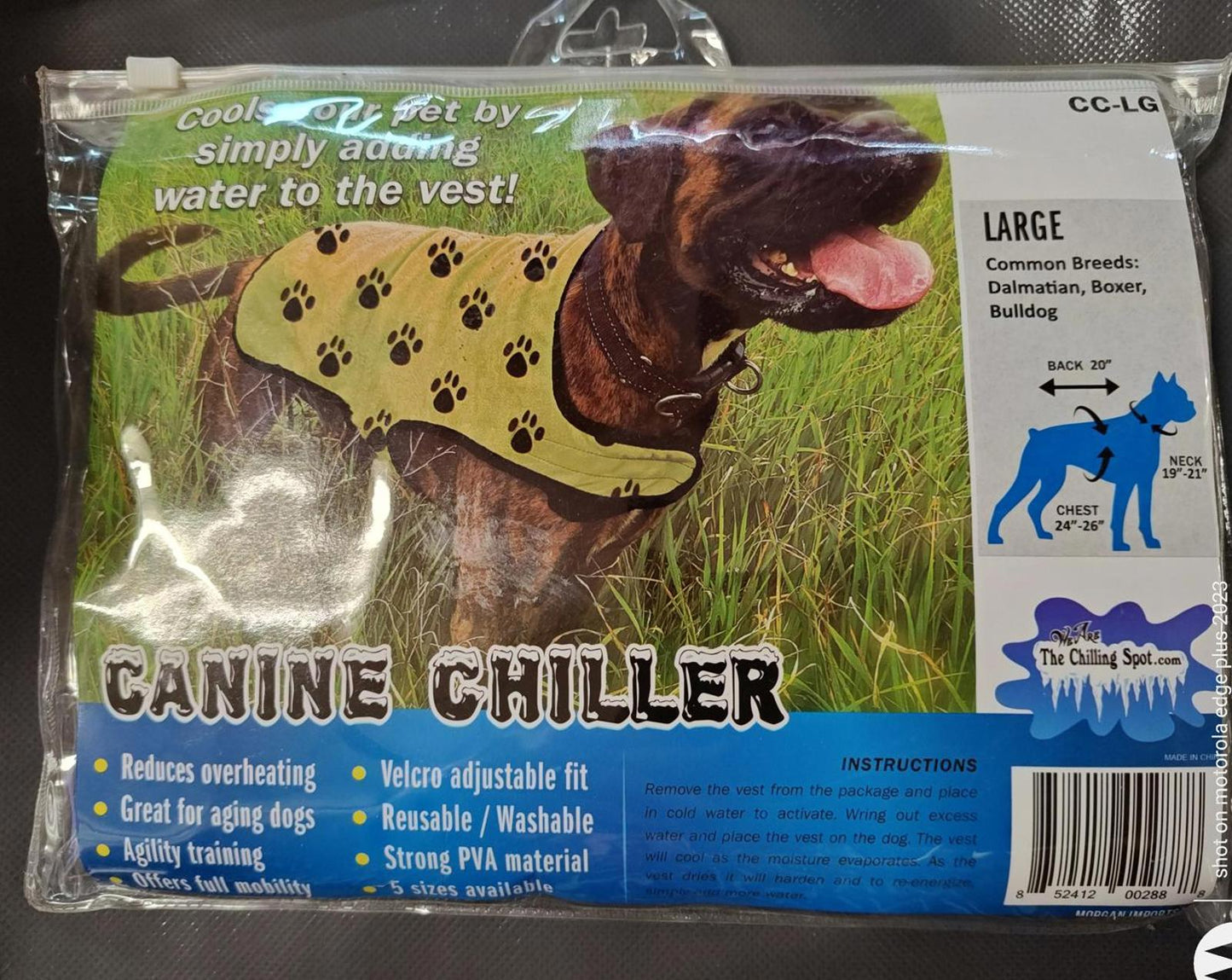 Canine Chiller dog vest in green with paw print design, ideal for cooling pets.