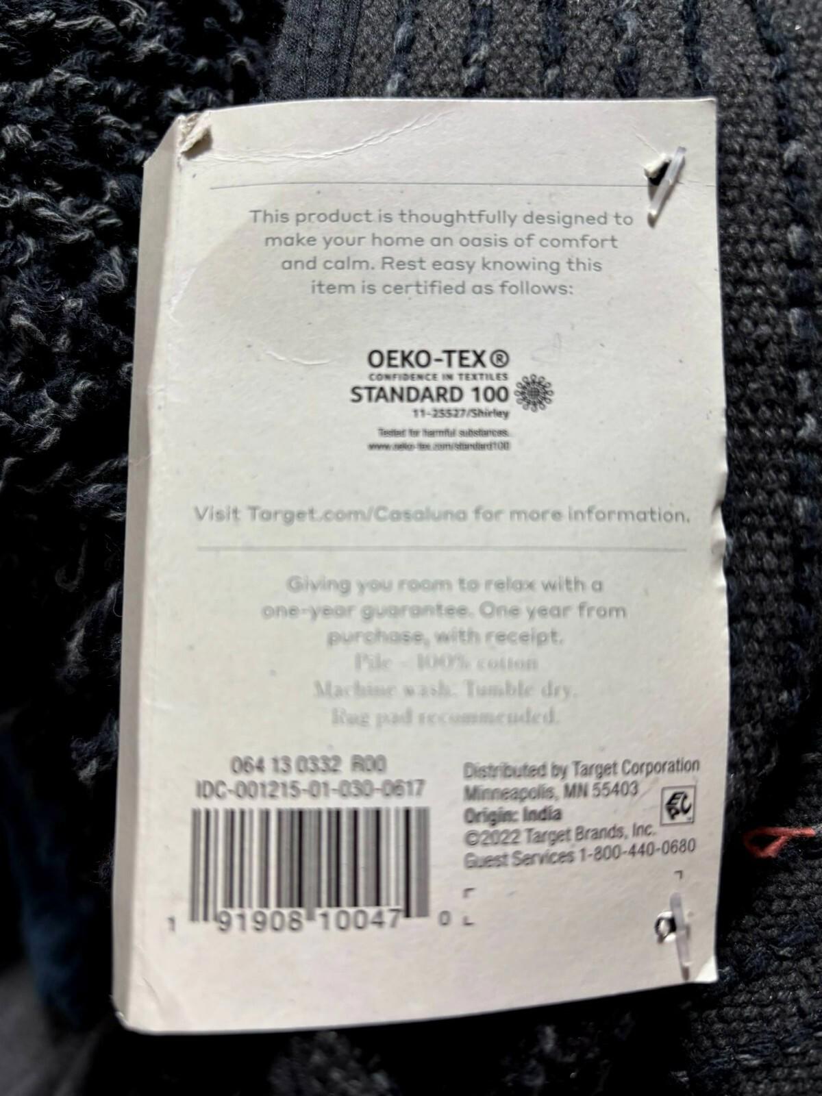 Casaluna throw blanket tag showing Oeko-Tex certification and care instructions.