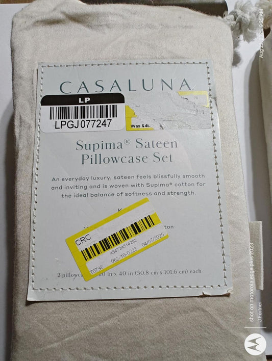 Casaluna Supima® Sateen Pillowcase Set in soft beige color, designed for comfort and luxury.