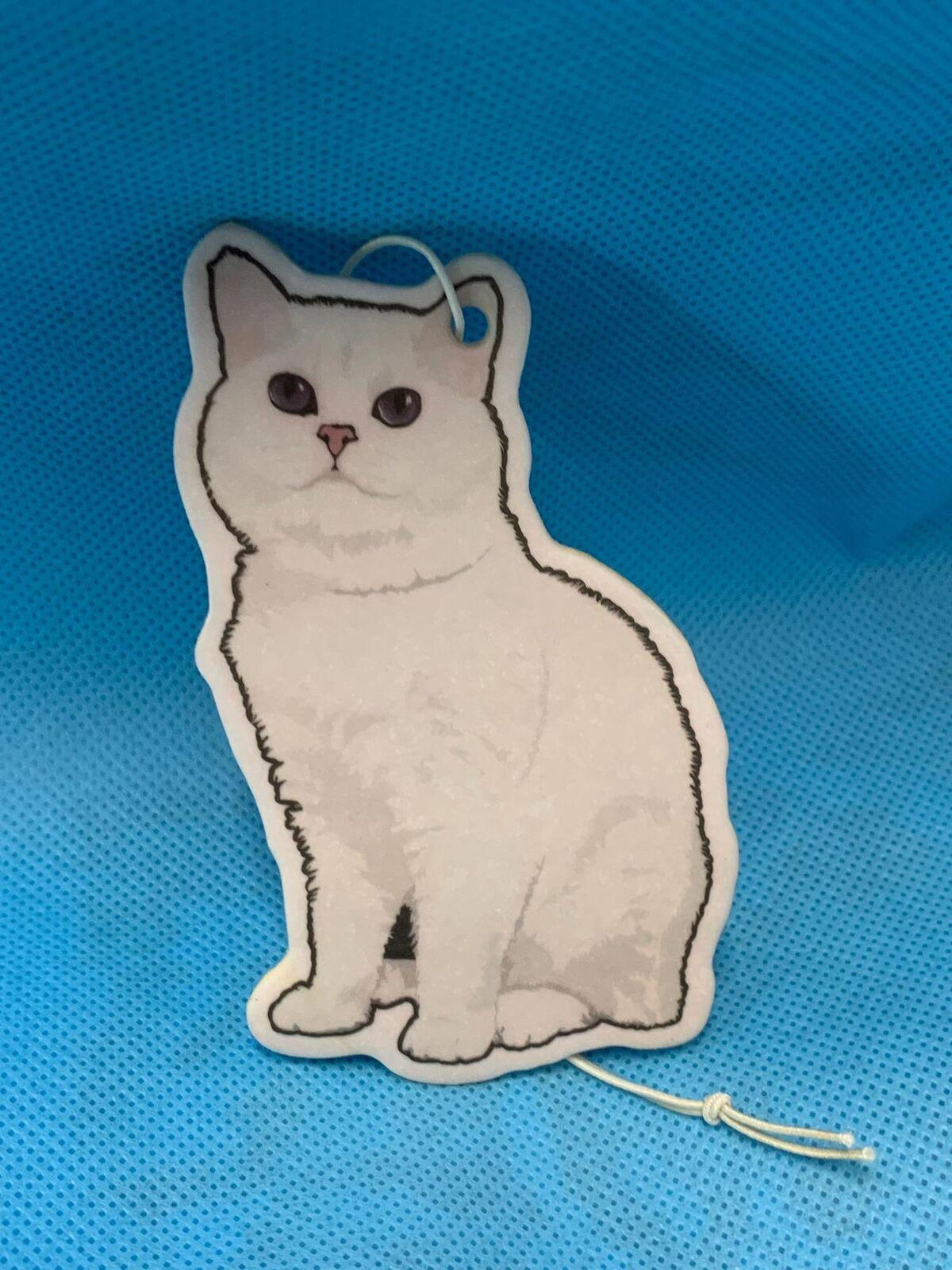 Cat-shaped tag featuring a white cat illustration with purple eyes.