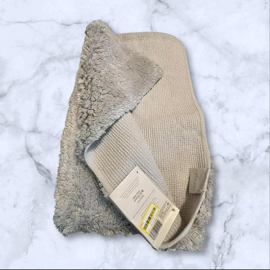 Cozy Beige Throw Blanket featuring soft texture and plush fabric.