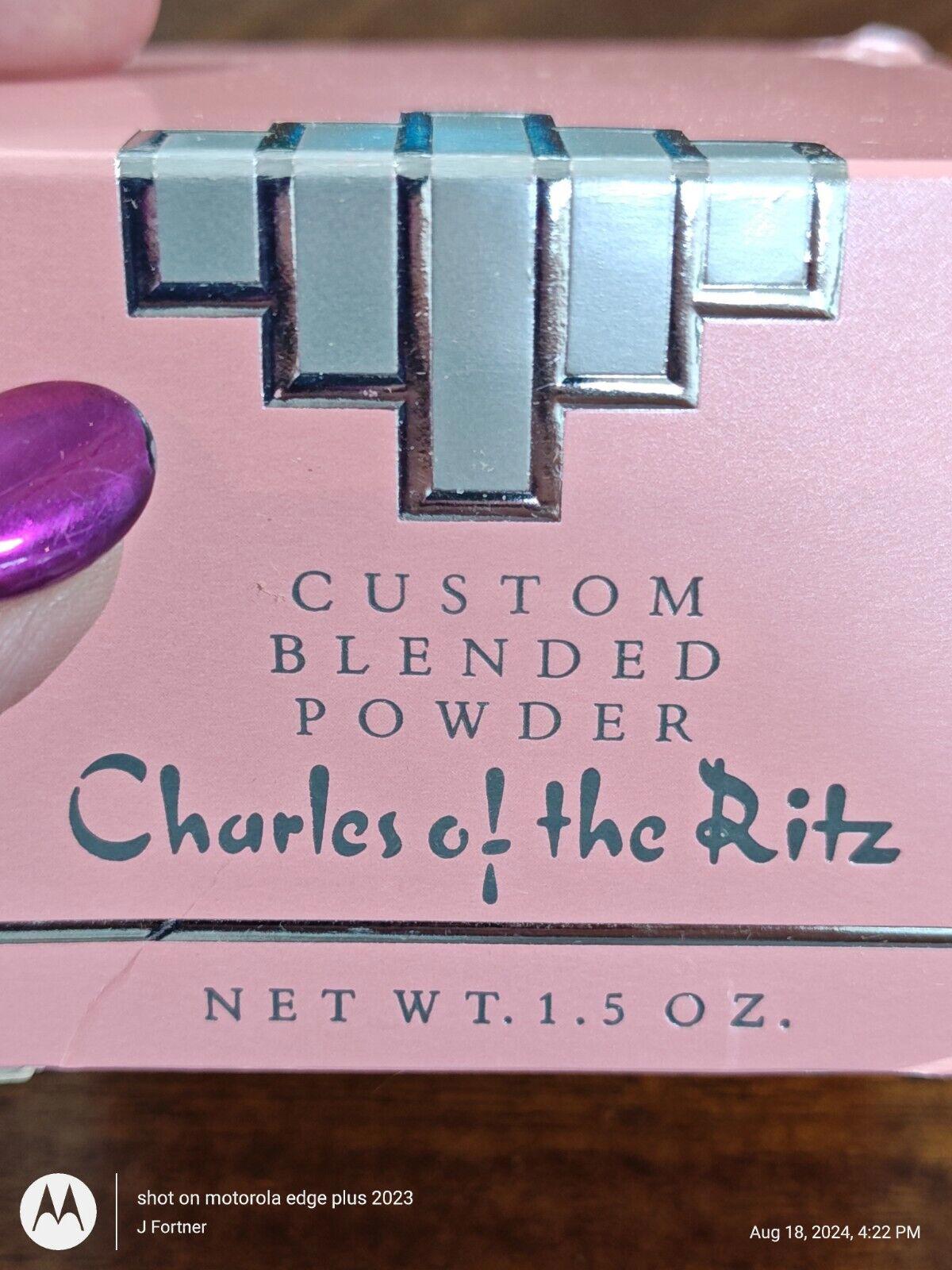 Charles of the Ritz custom blended powder in a pink box with silver accents.