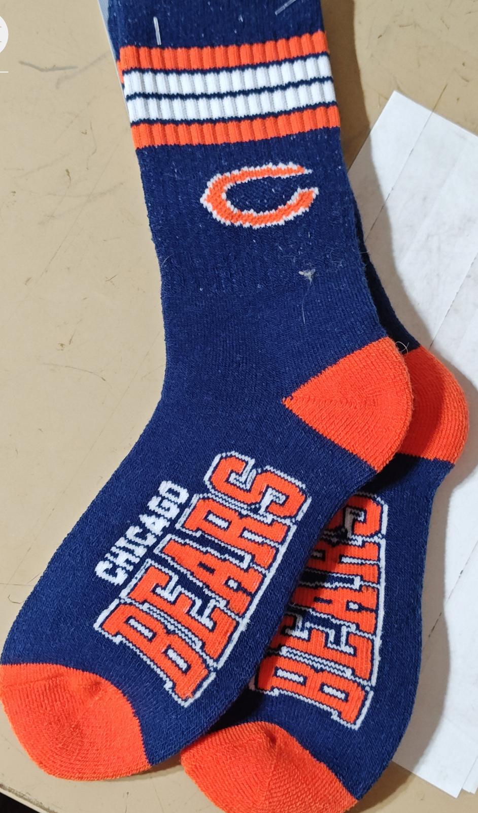 Chicago Bears socks featuring team colors and logo, perfect for fans.