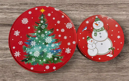 Christmas decorative plates featuring a snowman and a Christmas tree design.