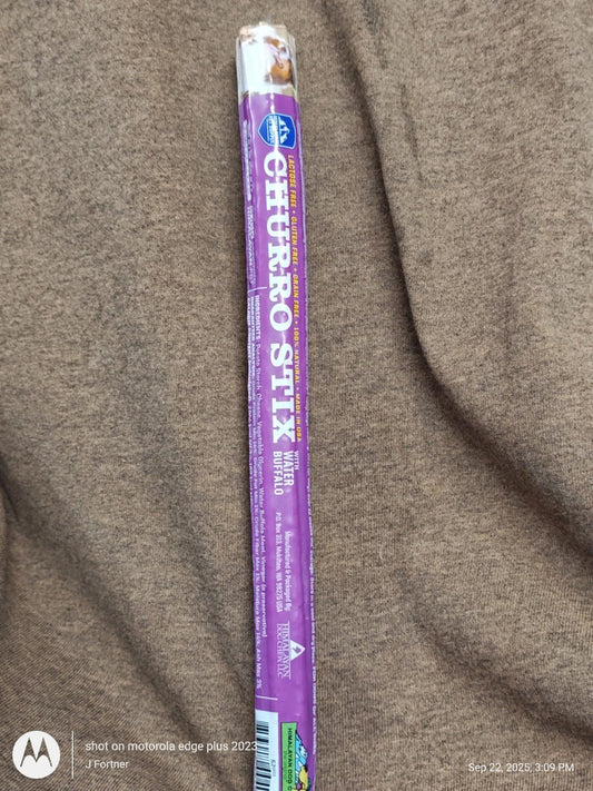 Churro Stix dog treat in a purple packaging, ideal for rewarding pets.