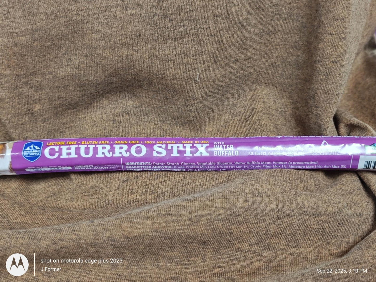 Churro Stix package featuring a purple design and clear branding.