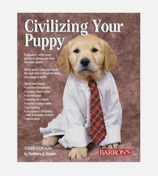 Civilizing Your Puppy book cover featuring a golden retriever puppy in a white shirt and red tie.