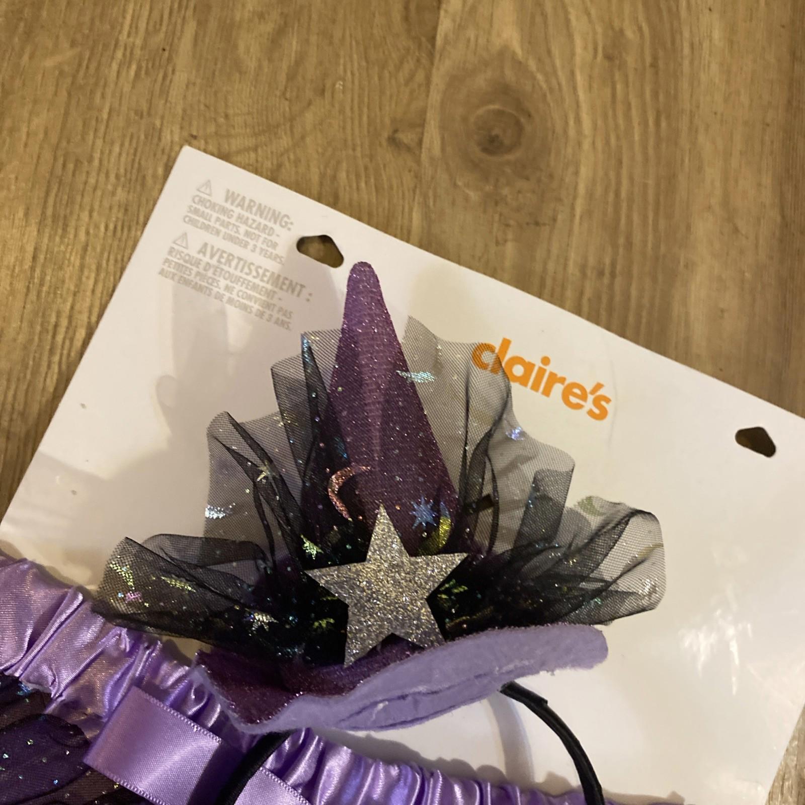 Claire's purple witch hat headband with glitter and star decoration.
