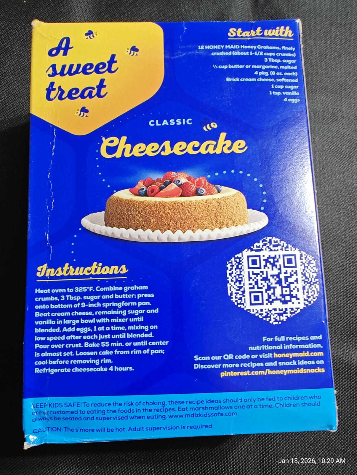 Classic Cheesecake box featuring a delicious cheesecake topped with berries.