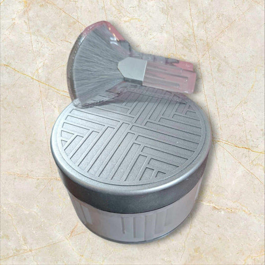 Dustbin with a patterned lid and a brush for easy cleaning.