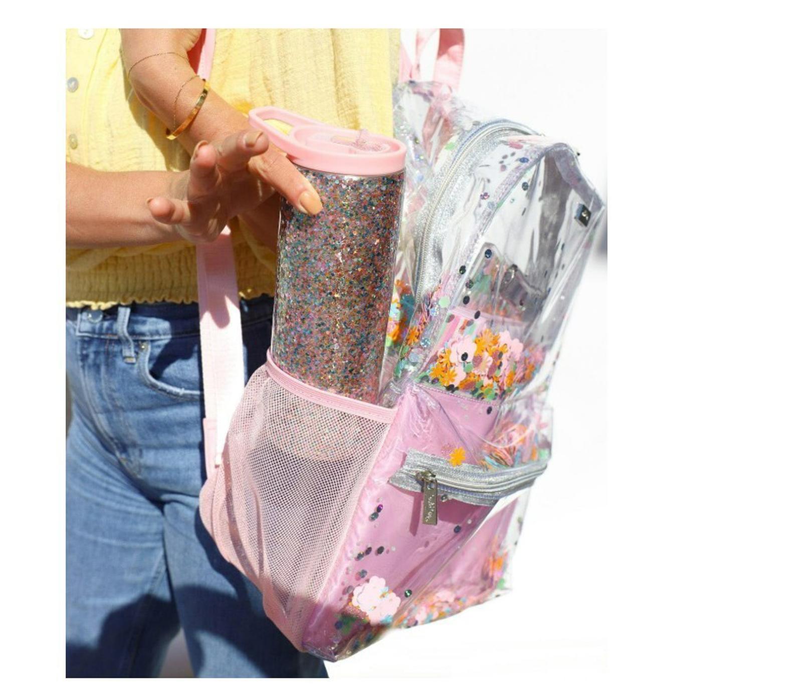 Clear backpack with pink accents and colorful confetti design, featuring a side pocket.