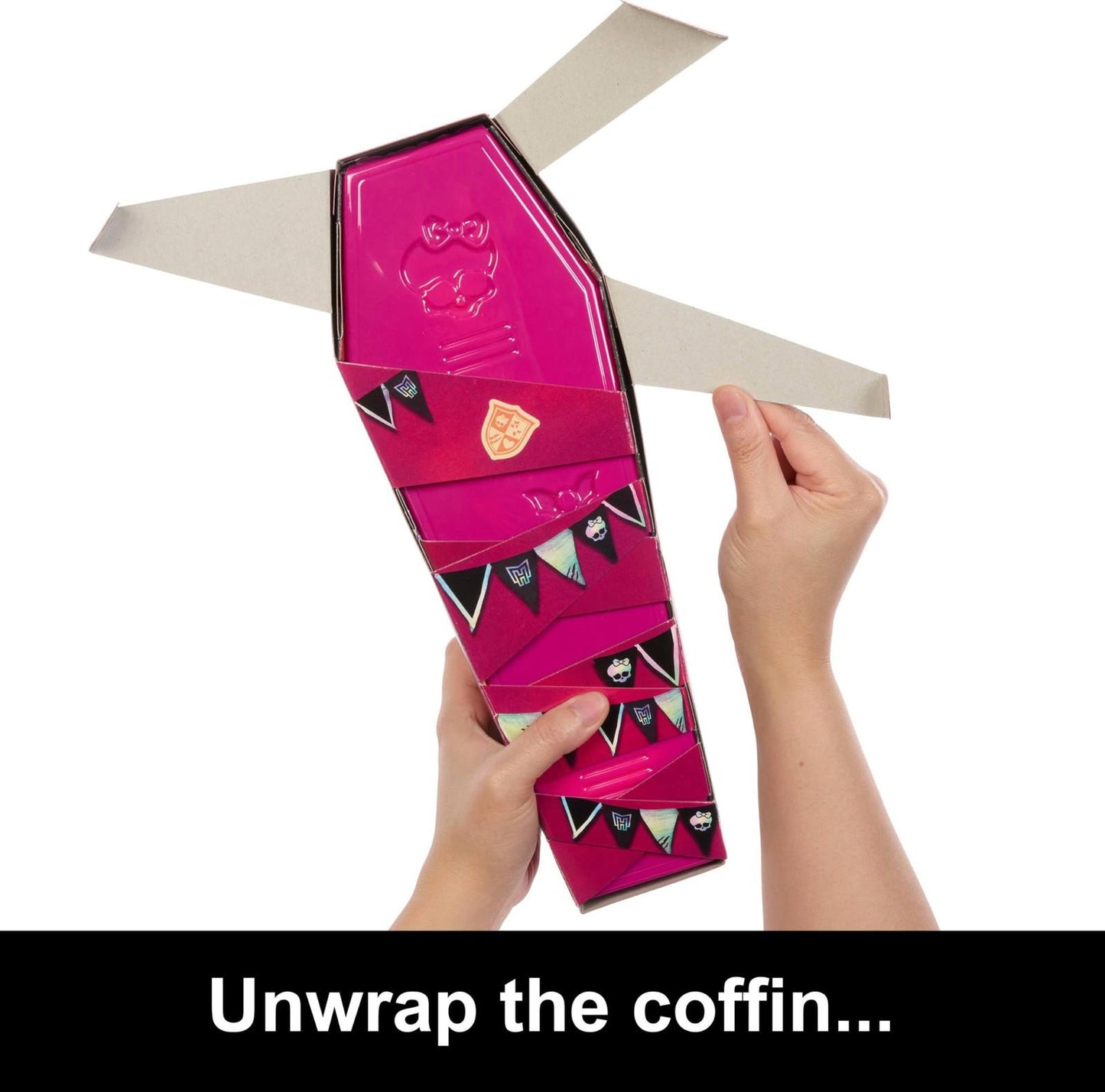 Coffin doll packaging featuring vibrant pink color and decorative flags. Unwrap the coffin for surprises.