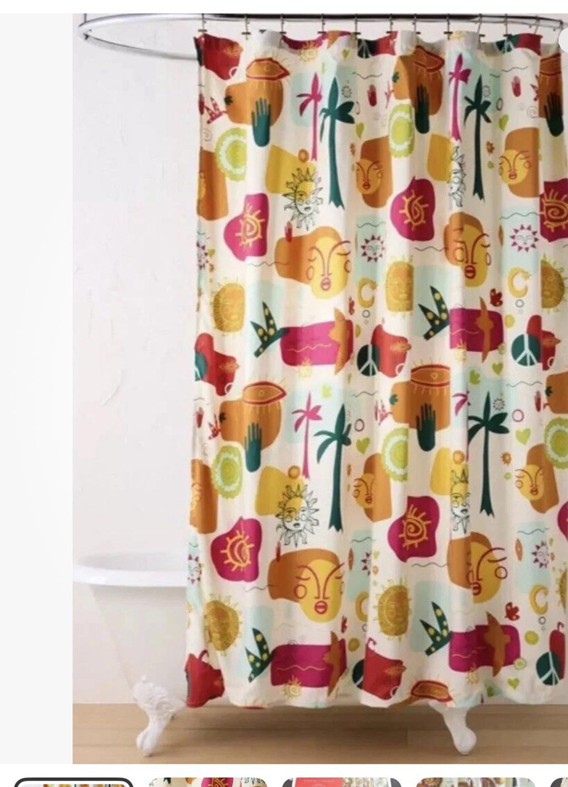 Colorful shower curtain featuring vibrant patterns of flowers and abstract shapes.