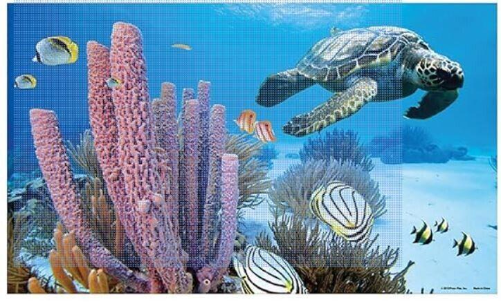 Underwater scene featuring a sea turtle swimming near vibrant coral and colorful fish.
