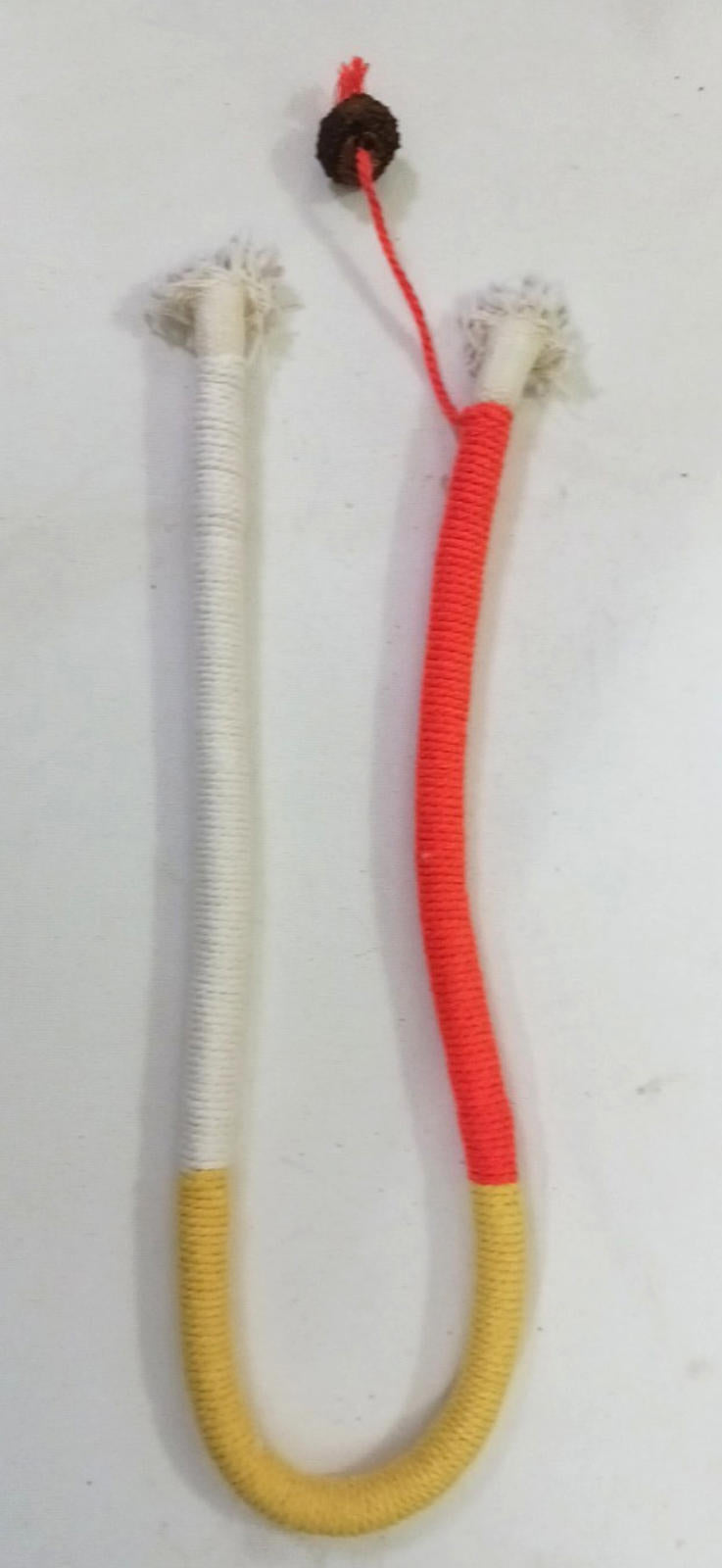 Colorful juggling poi with white, orange, and yellow sections, featuring tassels on both ends.
