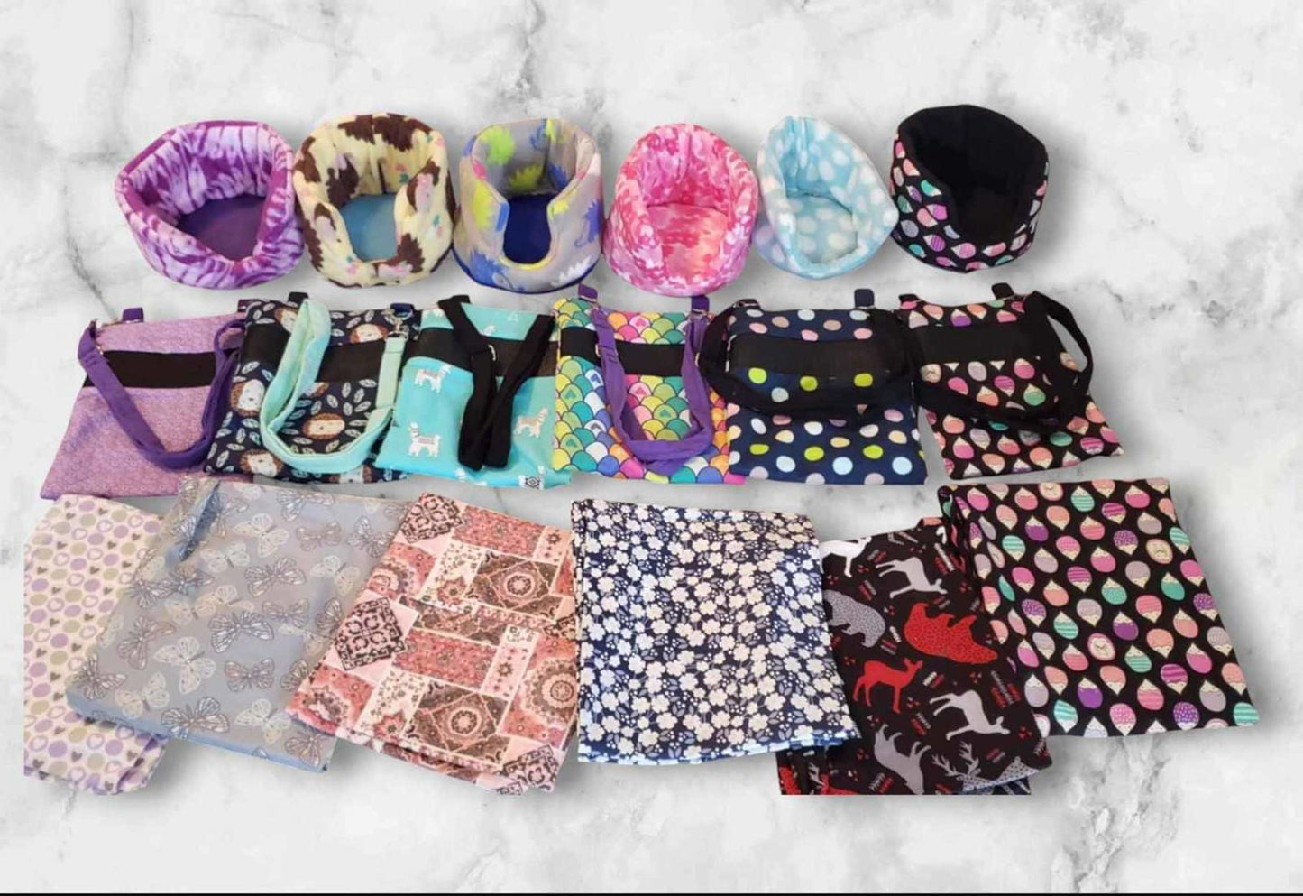 Colorful fabric bags and pouches featuring various patterns and designs, perfect for storage.
