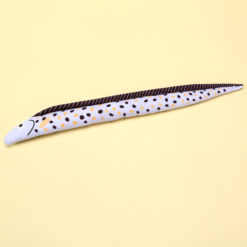 Colorful fish-shaped ceramic sushi plate with black and orange spots.