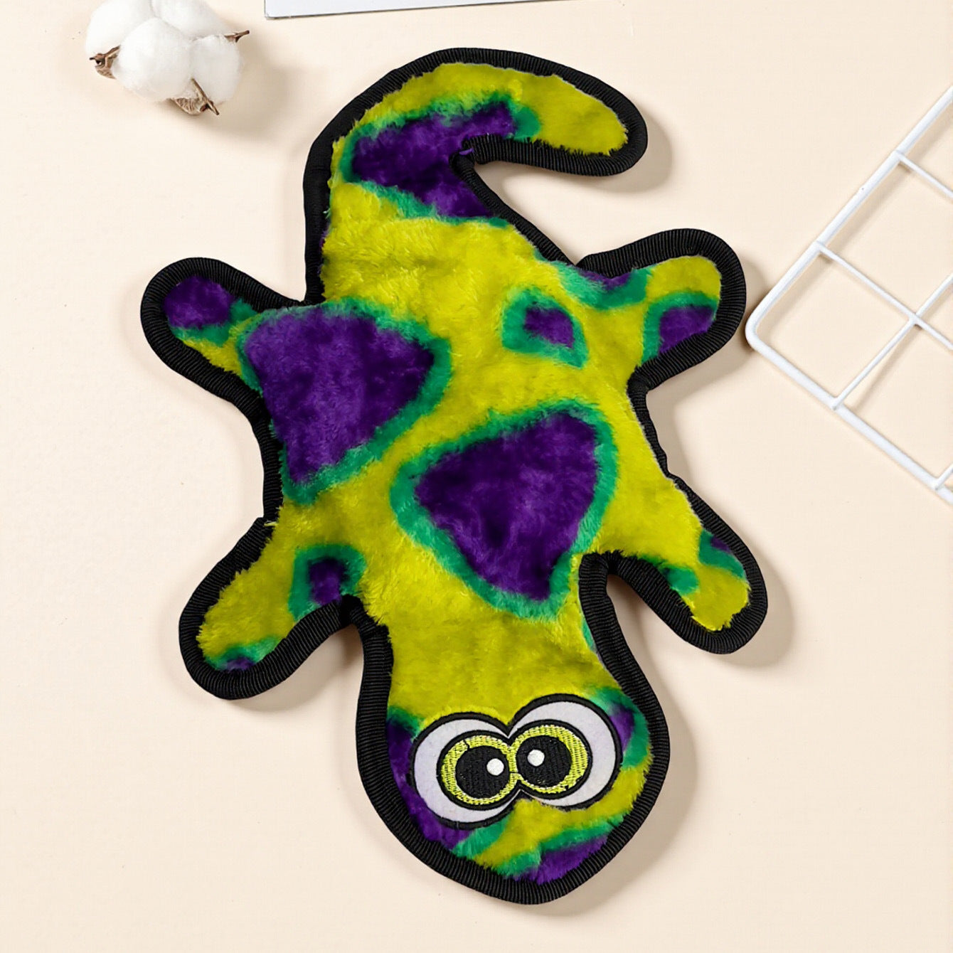 Colorful Plush Lizard Toy in vibrant green and purple with large eyes.