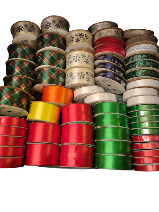 Colorful ribbon collection featuring red, green, and gold ribbons for crafting and decorating.