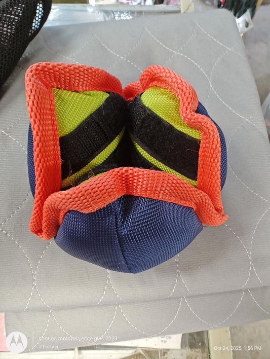 Product name not provided. Colorful training ball with red and black accents, designed for durability.