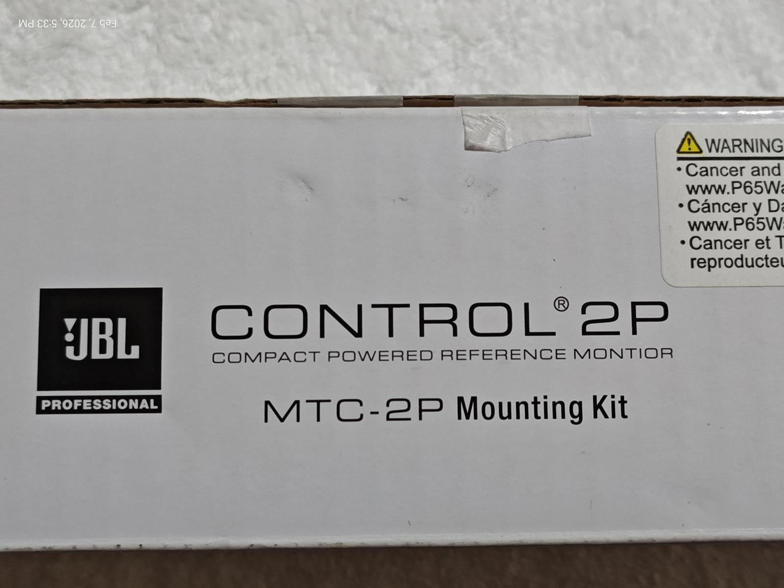 CONTROL 2P compact powered reference monitor with MTC-2P mounting kit packaging.