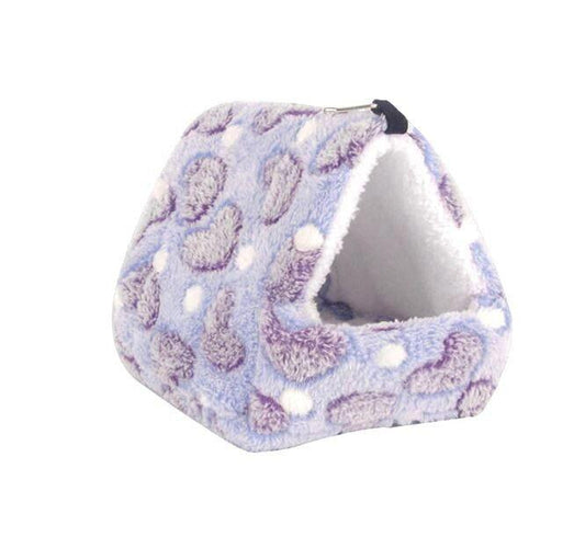 Cozy Cat Bed with purple and white polka dots, perfect for small pets.