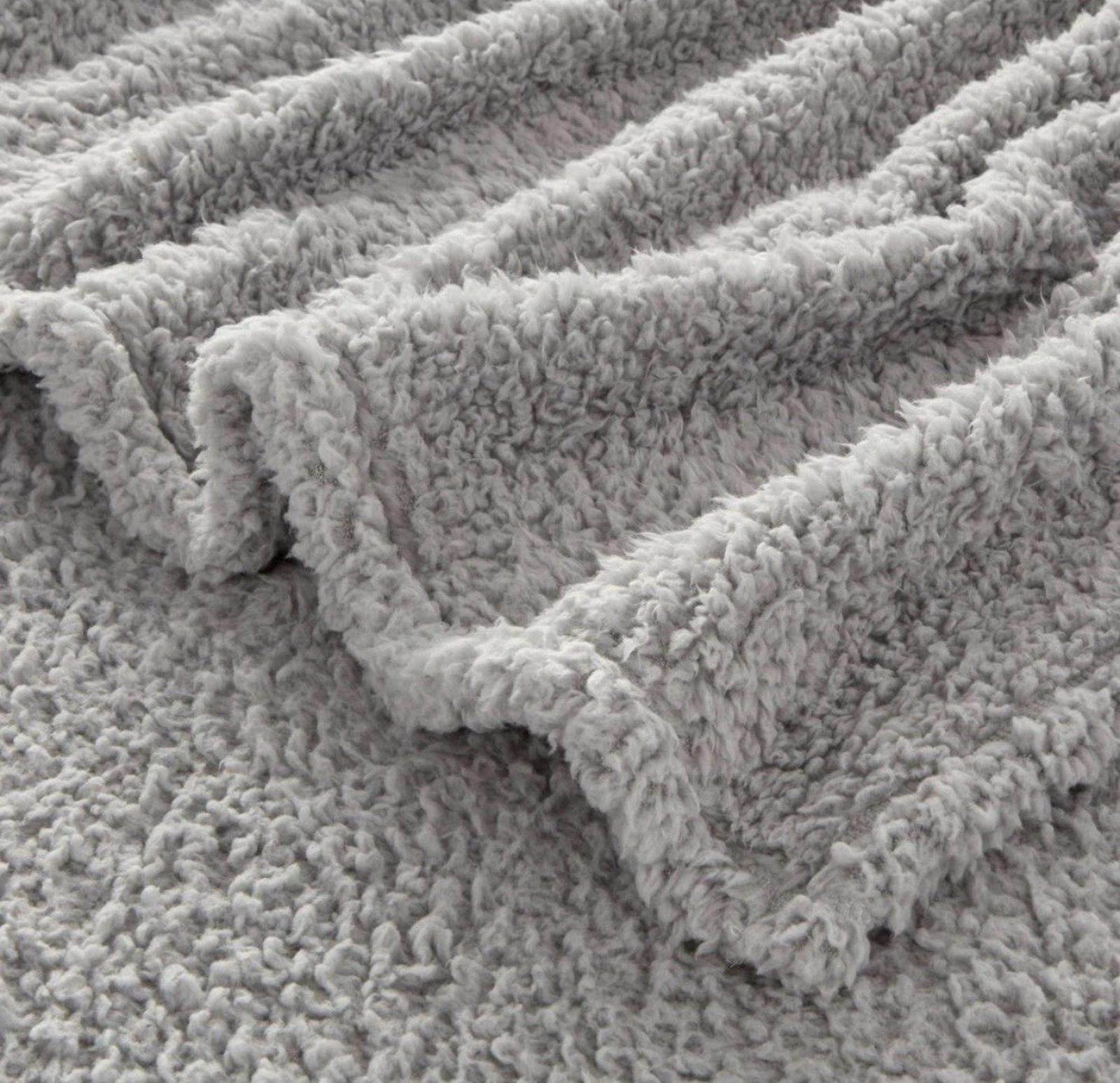 Cozy Grey Fleece Blanket with soft, fluffy texture for warmth and comfort.