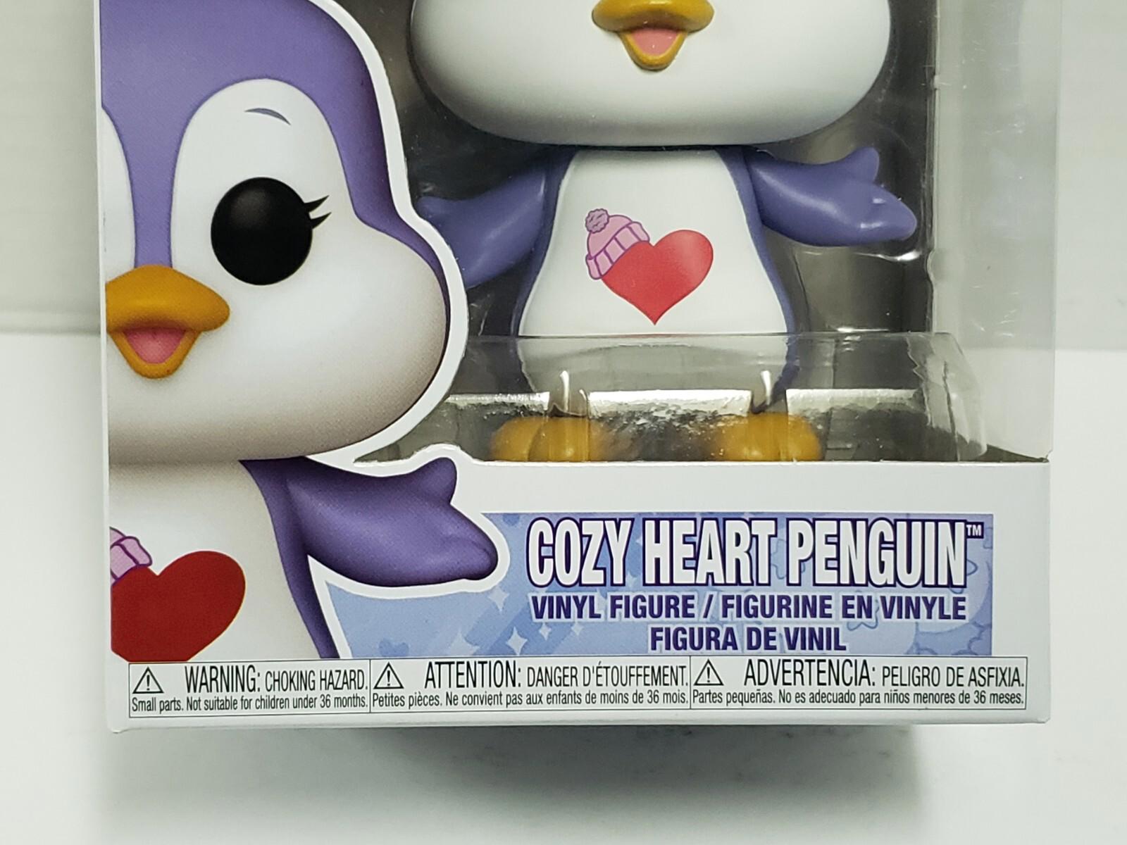 Cozy Heart Penguin vinyl figure with a purple and white design, featuring a heart on its chest.