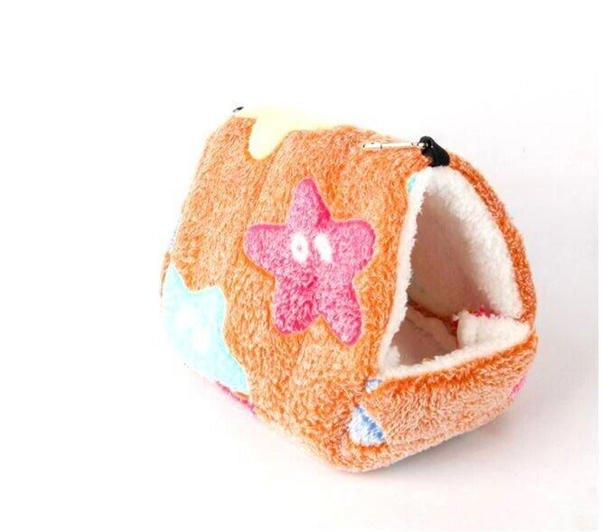 Cozy pet cave bed with colorful star design, perfect for small animals.