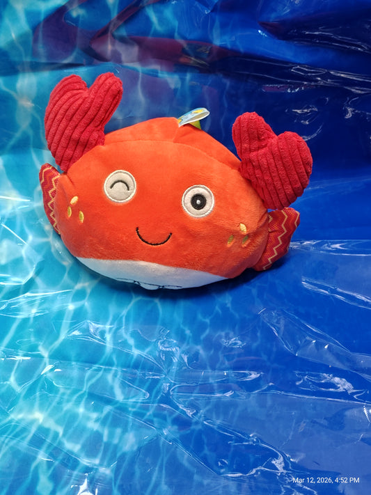 Crab plush toy with red and orange colors, featuring a happy face and textured claws.