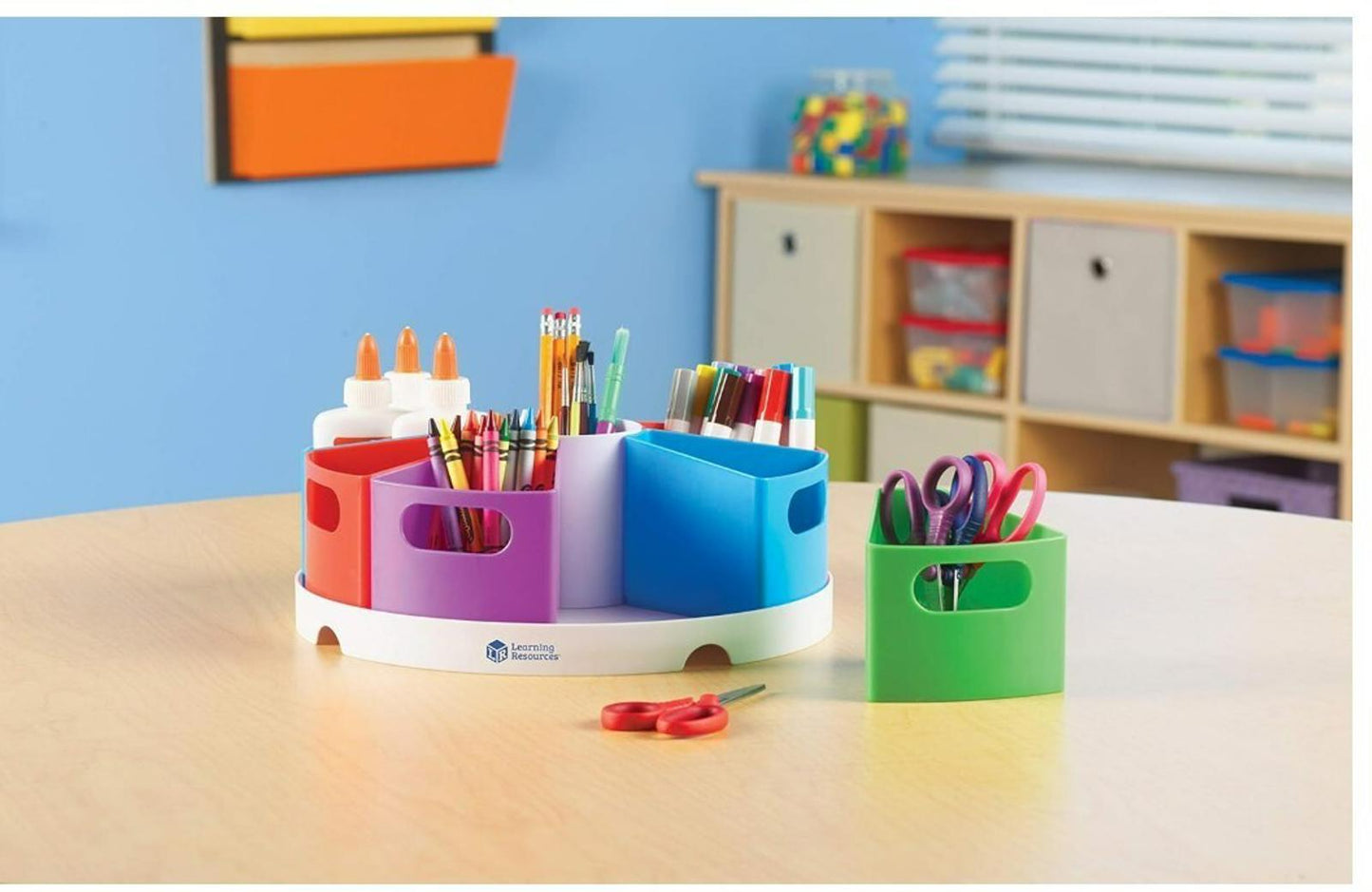 Colorful art supply organizer with compartments for scissors, markers, and glue.