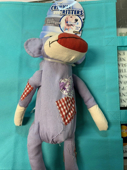 Crinkle Critters plush toy in purple with red accents and patchwork design.