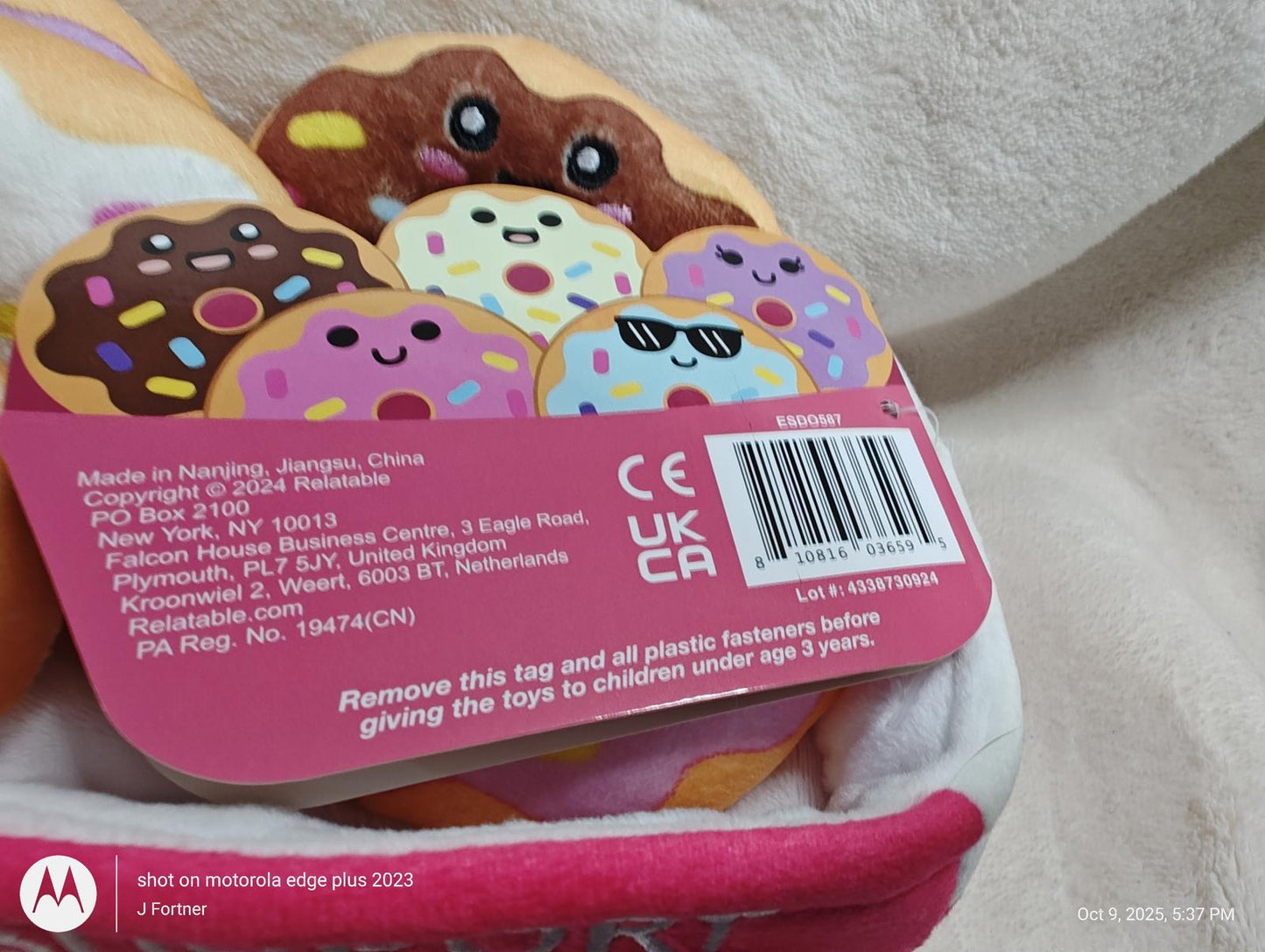 Cute donut plush toy featuring colorful sprinkles and sunglasses.