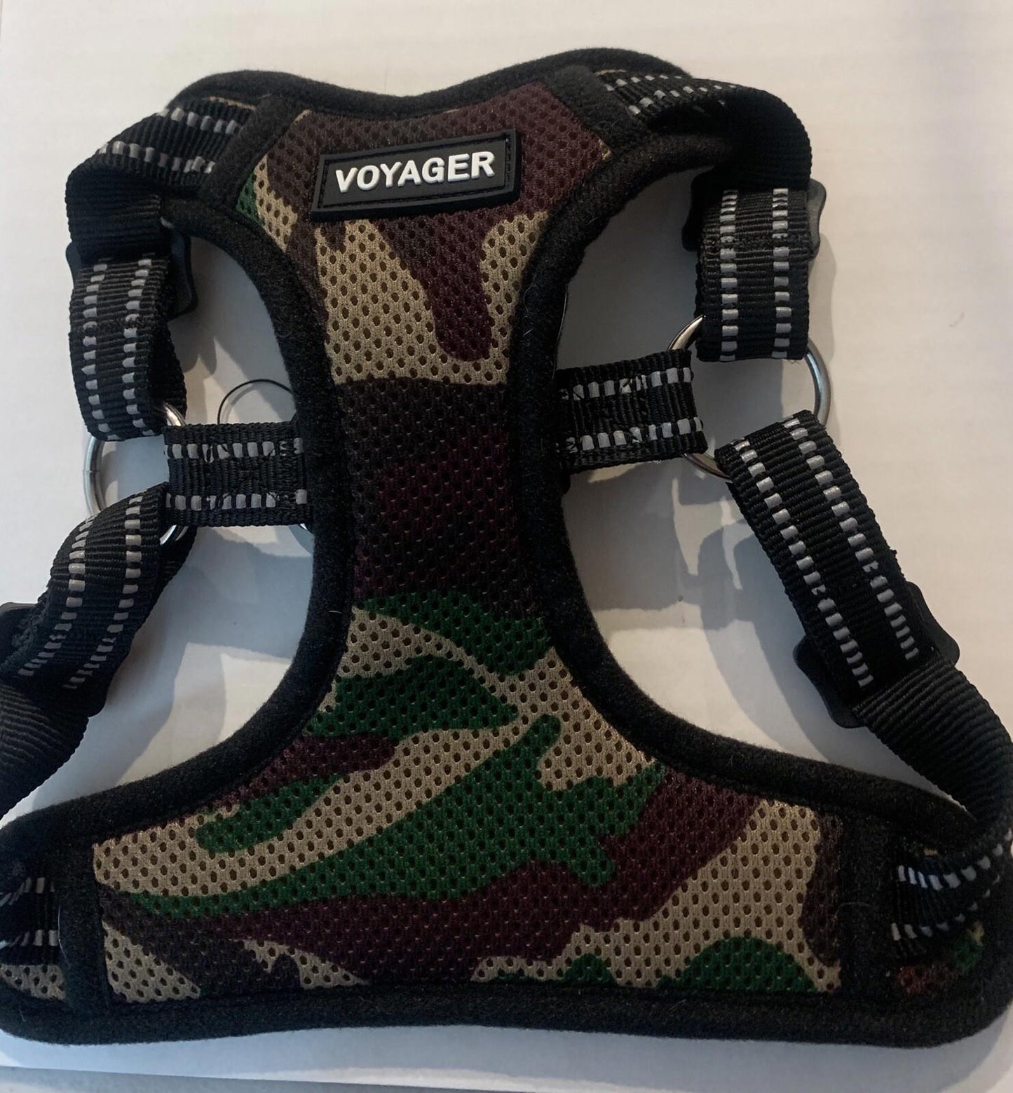 Voyager camouflage dog harness with adjustable straps and breathable mesh.