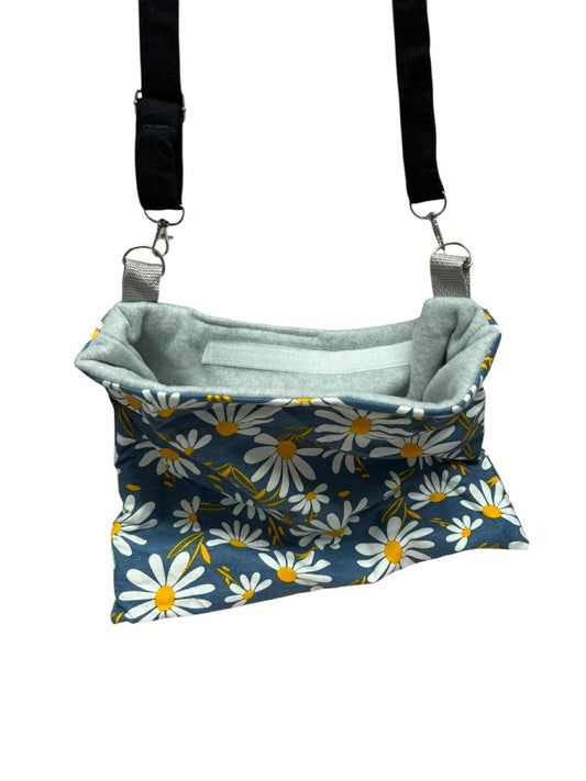 Daisy Print Shoulder Bag featuring a floral design and adjustable straps.