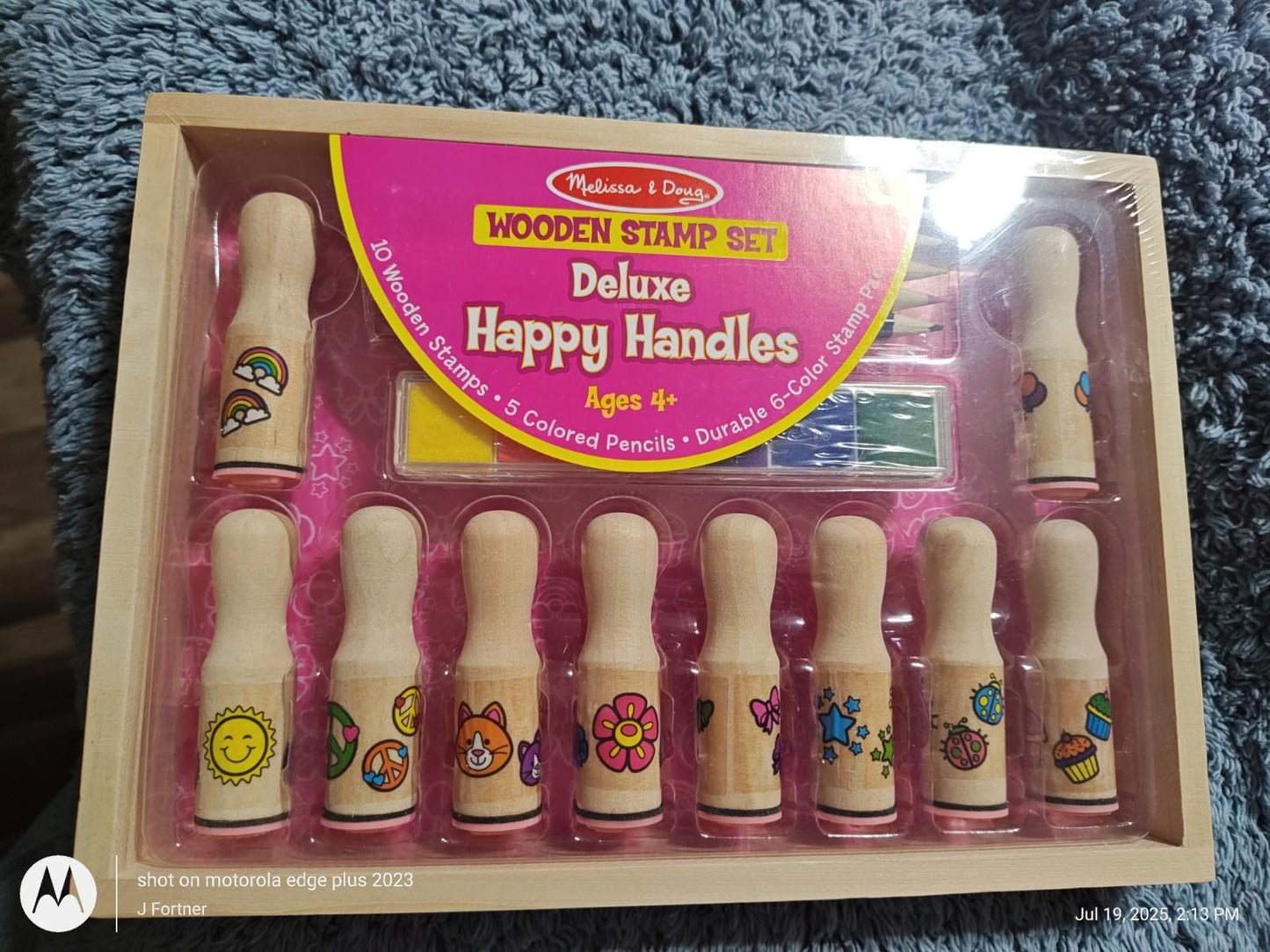 Deluxe Happy Handles wooden stamp set featuring colorful designs and handles for creative fun.