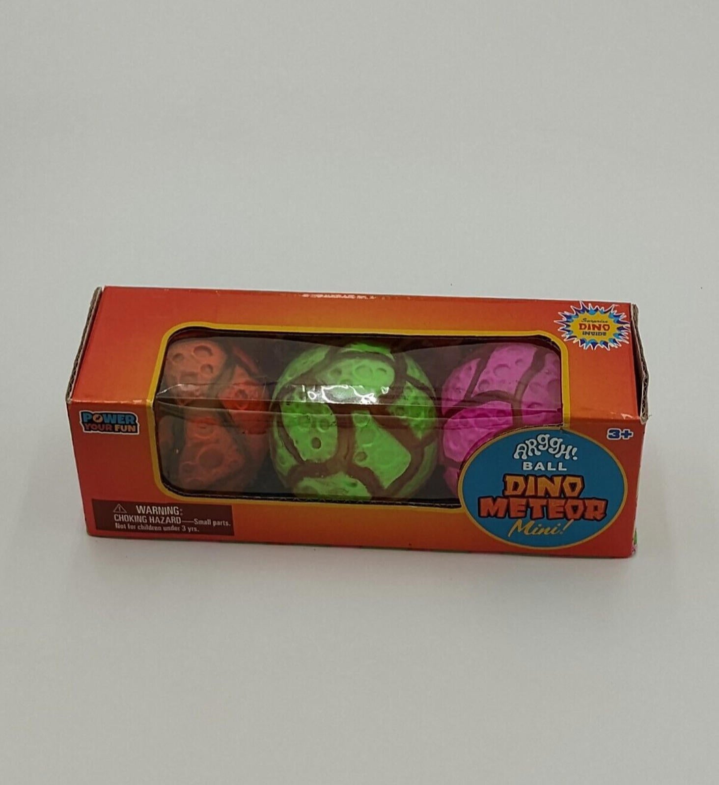 Dino Meteor Mini toy set featuring colorful dinosaur-shaped balls in a box.