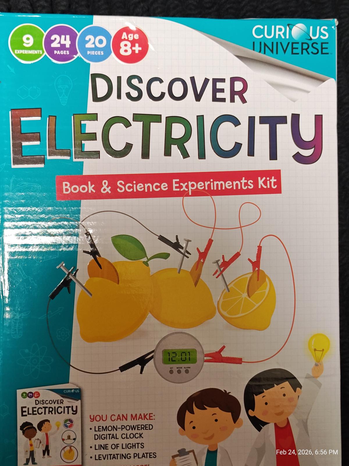 Discover Electricity book and science experiments kit featuring lemon battery setup and colorful wires.