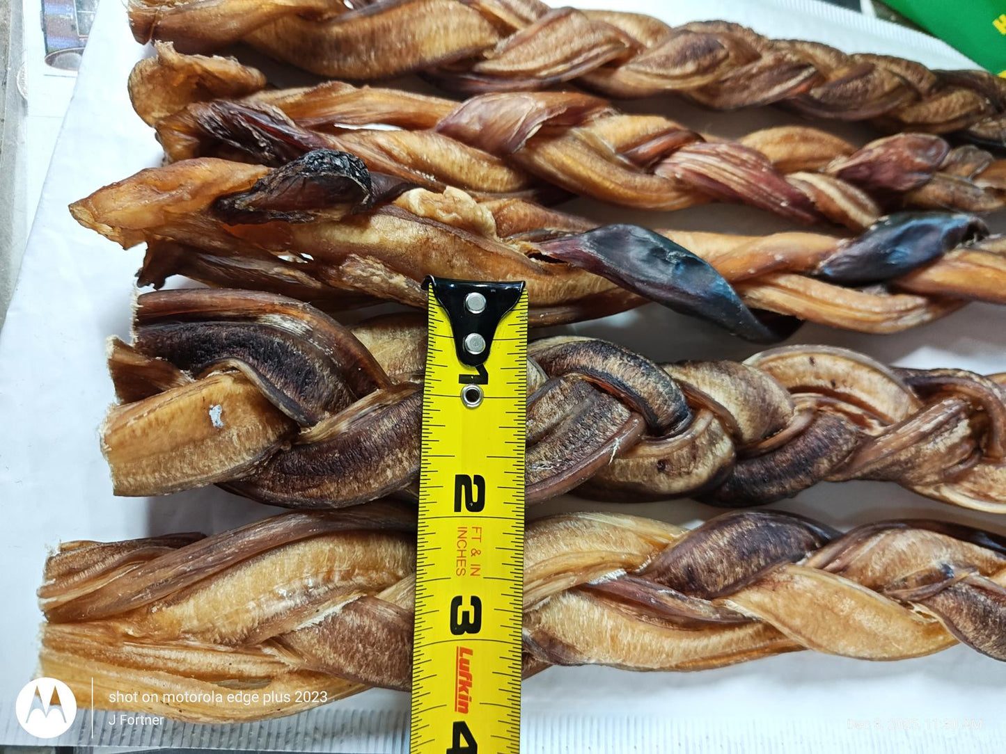 Dog Chew Treats are braided and measure approximately 2 inches wide, showcasing a rich brown color.