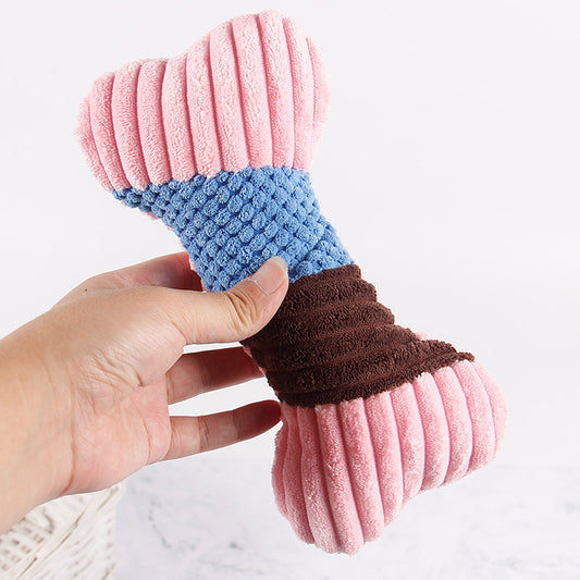 Dog chew toy bone in pink, blue, and brown colors, perfect for playful pets.