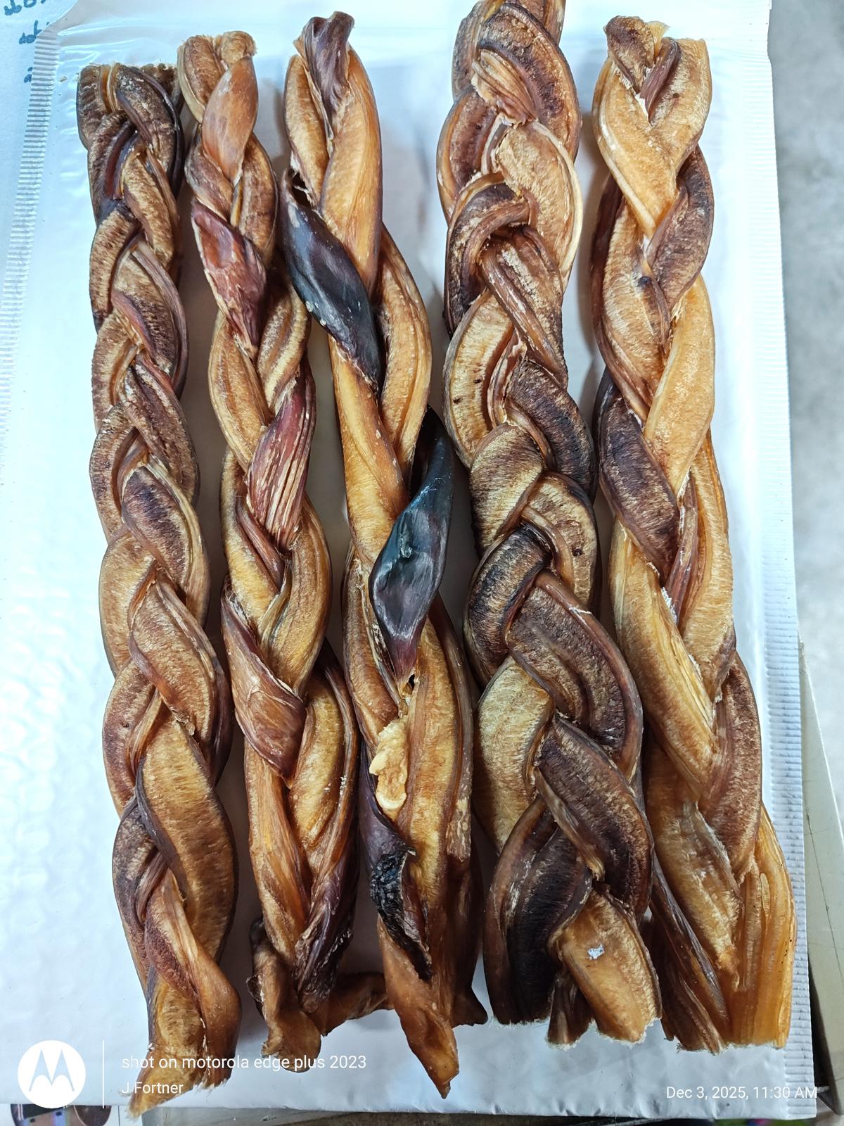 Dog Chews braided treats in various shades of brown, perfect for chewing and dental health.