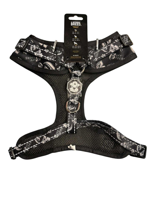 Adjustable dog harness featuring a stylish black and white design with a comfortable mesh lining.