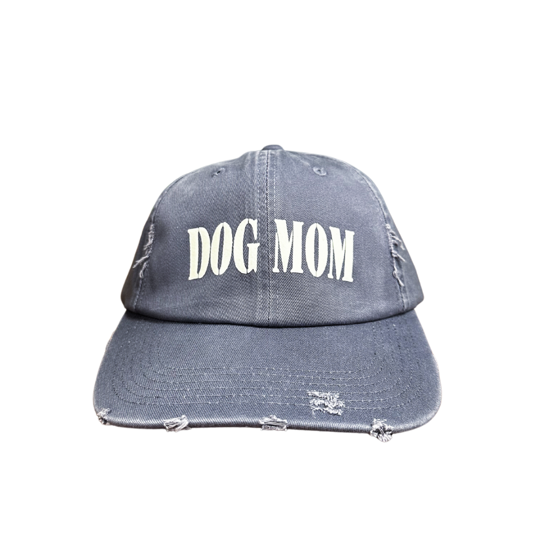 Dog Mom cap featuring a distressed design and white lettering.